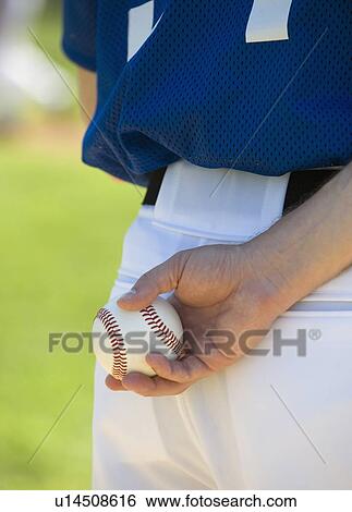 Baseball pitcher preparing to pitch ball View Large Photo Image Stock Photograph - Baseball pitcher preparing to pitch ball. Fotosearch