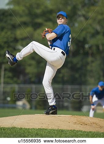 Baseball pitcher preparing to pitch ball View Large Photo Image Stock Photography - Baseball pitcher preparing to pitch ball. Fotosearch
