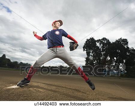 Baseball pitcher throwing ball View Large Photo Image Stock Image - Baseball pitcher throwing ball. Fotosearch