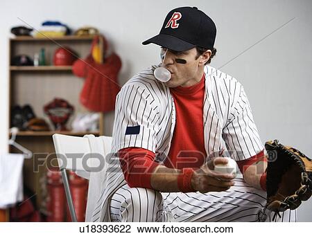 Baseball player blowing bubble with gum in locker room View Large Photo Image Stock Image - Baseball player blowing bubble with gum in locker room. Fotosearch