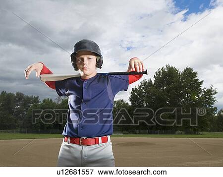 Baseball player posing with bat View Large Photo Image Stock Photo - Baseball player posing with bat. Fotosearch