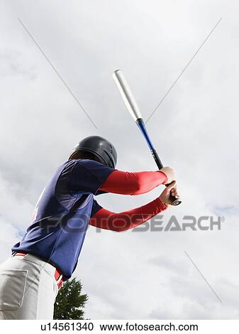 Baseball player reading to swing bat View Large Photo Image Stock Image - Baseball player reading to swing bat. Fotosearch
