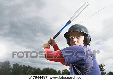 Baseball player reading to swing bat View Large Photo Image Stock Photo - Baseball player reading to swing bat. Fotosearch