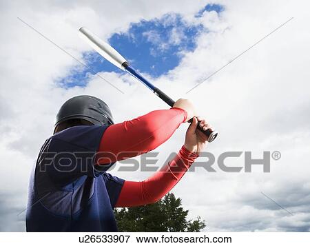 Baseball player reading to swing bat View Large Photo Image Stock Photo - Baseball player reading to swing bat. Fotosearch