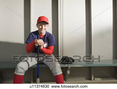 Baseball player sitting in dugout View Large Photo Image Stock Image - Baseball player sitting in dugout. Fotosearch