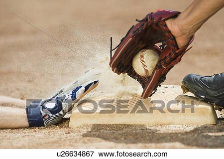 Baseball player sliding into home base View Large Photo Image Stock Photo - Baseball player sliding into home base. Fotosearch