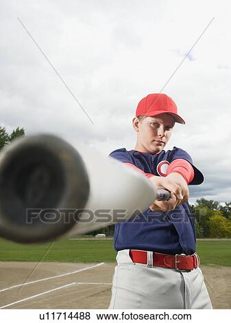 Stock Photo - Baseball player swinging bat. Fotosearch