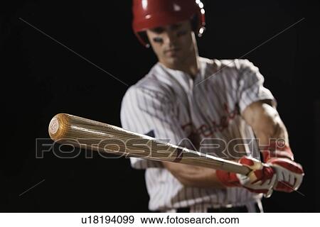 Stock Photo - Baseball player swinging bat. Fotosearch