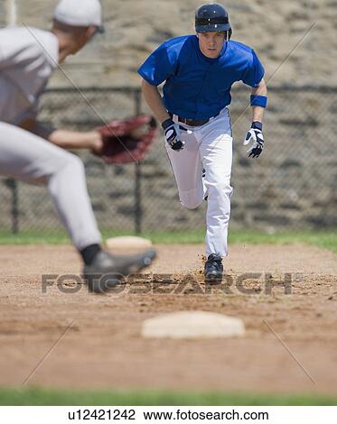 Baseball player trying to steal base View Large Photo Image Stock Image - Baseball player trying to steal base. Fotosearch