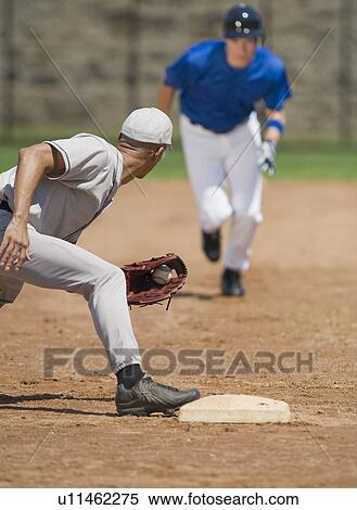 Baseball player trying to steal base View Large Photo Image Stock Photography - Baseball player trying to steal base. Fotosearch