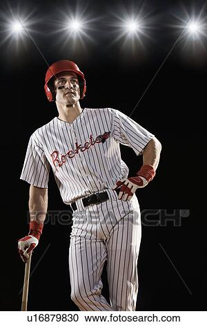 Stock Image - Baseball player waiting to bat. Fotosearch
