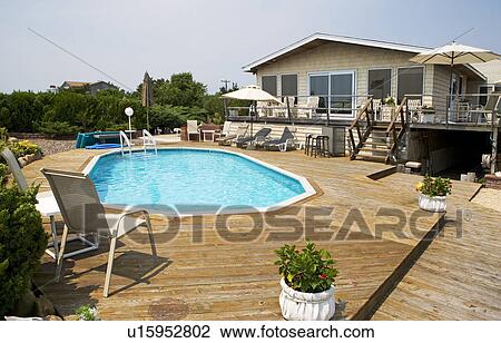 Stock Image - Beachfront house with swimming pool. Fotosearch