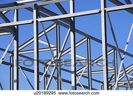 Beams at construction site under blue sky View Large Photo Image Stock Photography - Beams at construction site under blue sky. Fotosearch