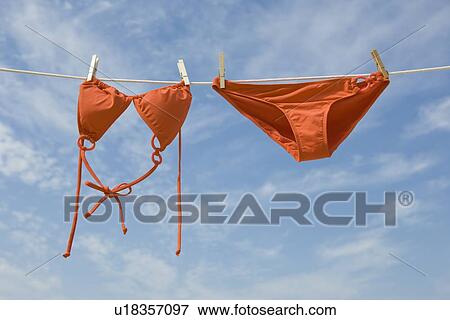 Bikini hanging from clothesline View Large Photo Image Stock Photo - Bikini hanging from clothesline. Fotosearch