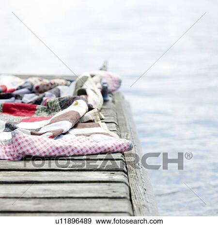 Stock Photo - Blanket on dock. Fotosearch