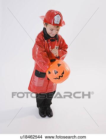 Boy dressed in fireman Halloween costume View Large Photo Image Picture - Boy dressed in fireman Halloween costume. Fotosearch