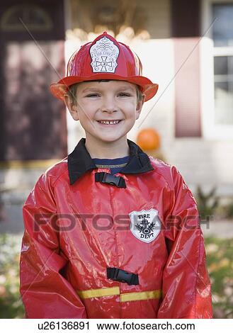 Boy dressed in fireman Halloween costume View Large Photo Image Stock Image - Boy dressed in fireman Halloween costume. Fotosearch