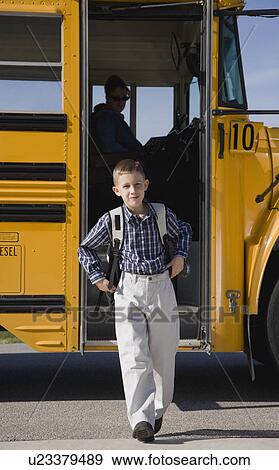 Boy getting off school bus View Large Photo Image Stock Photo - Boy getting off school bus. Fotosearch