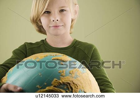 Boy holding globe View Large Photo Image Stock Image - Boy holding globe. Fotosearch
