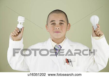 Boy holding light bulbs View Large Photo Image Stock Image - Boy holding light bulbs. Fotosearch