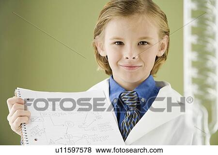 Boy holding science notebook View Large Photo Image Stock Photo - Boy holding science notebook. Fotosearch