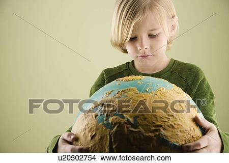 Boy hugging globe View Large Photo Image Picture - Boy hugging globe. Fotosearch