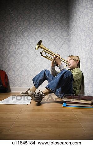 Boy playing trumpet View Large Photo Image Picture - Boy playing trumpet. Fotosearch