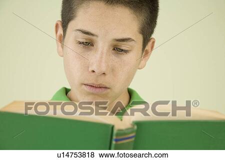 Stock Photo - Boy reading book. Fotosearch