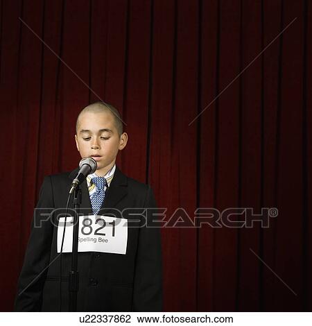 Boy wearing number and speaking on stage View Large Photo Image Stock Image - Boy wearing number and speaking on stage. Fotosearch