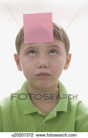 Boy with sticky note on forehead View Large Photo Image Stock Image - Boy with sticky note on forehead. Fotosearch