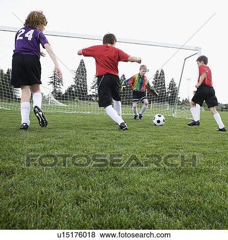 Boys playing competitive soccer View Large Photo Image Stock Photo - Boys playing competitive soccer. Fotosearch