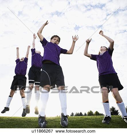 Boys soccer team celebrating on field View Large Photo Image Stock Photo - Boys soccer team celebrating on field. Fotosearch