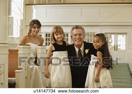 Picture - Bride and family in church. Fotosearch