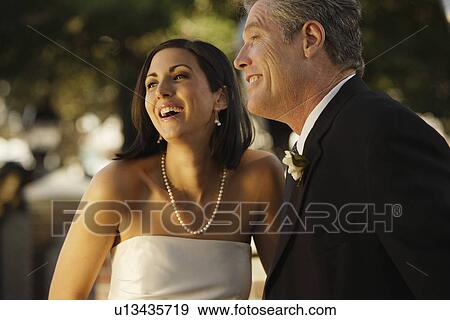 Stock Photo - Bride and father laughing. Fotosearch