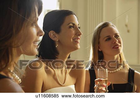 Bride drinking champagne with friends View Large Photo Image Stock Photography - Bride drinking champagne with friends. Fotosearch