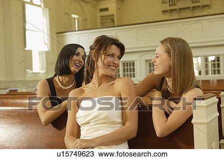 Bride laughing with friends View Large Photo Image Stock Image - Bride laughing with friends. Fotosearch