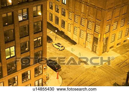 Stock Image - Brooklyn buildings and street at night. Fotosearch