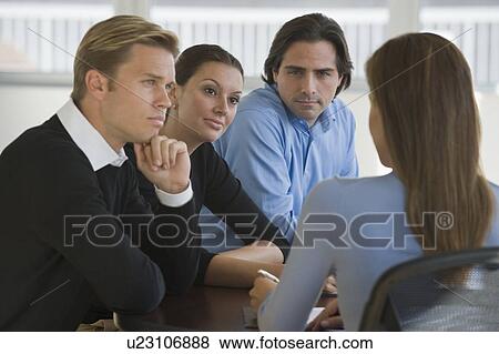 Stock Photo - Business people in meeting. Fotosearch