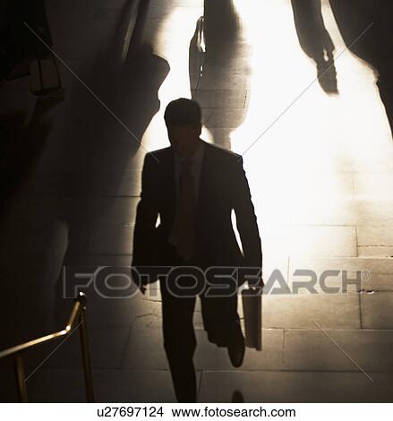 Businessman climbing steps at Grand Central Station View Large Photo Image Picture - Businessman climbing steps at Grand Central Station. Fotosearch