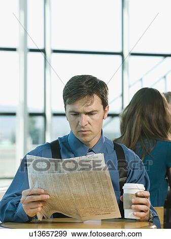 Businessman reading newspaper View Large Photo Image Stock Photo - Businessman reading newspaper. Fotosearch