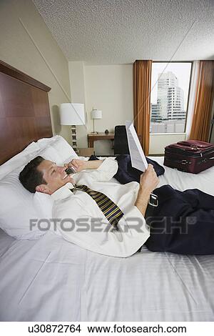 Businessman talking on cell phone View Large Photo Image Picture - Businessman talking on cell phone. Fotosearch