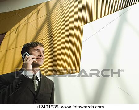 Businessman talking on cell phone View Large Photo Image Stock Photo - Businessman talking on cell phone. Fotosearch