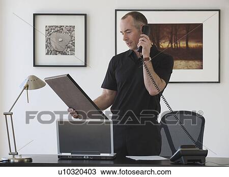Businessman talking on telephone View Large Photo Image Stock Image - Businessman talking on telephone. Fotosearch