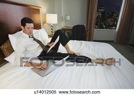 Stock Photography - Businessman typing on laptop. Fotosearch
