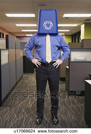 Businessman with recycling bin on head View Large Photo Image Picture - Businessman with recycling bin on head. Fotosearch