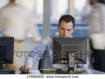 Businessman working at computer View Large Photo Image Stock Image - Businessman working at computer. Fotosearch