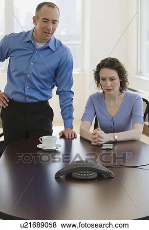 Businesspeople having conference call View Large Photo Image Stock Photo - Businesspeople having conference call. Fotosearch
