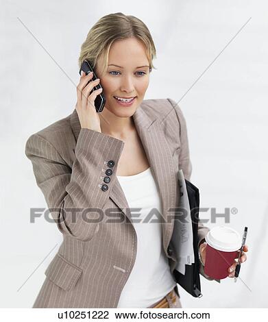 Stock Image - Businesswoman on the move. Fotosearch