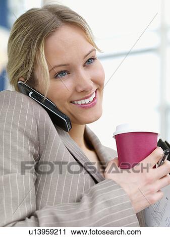Stock Image - Businesswoman on the move. Fotosearch