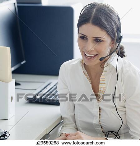 Businesswoman wearing headset View Large Photo Image Stock Photo - Businesswoman wearing headset. Fotosearch